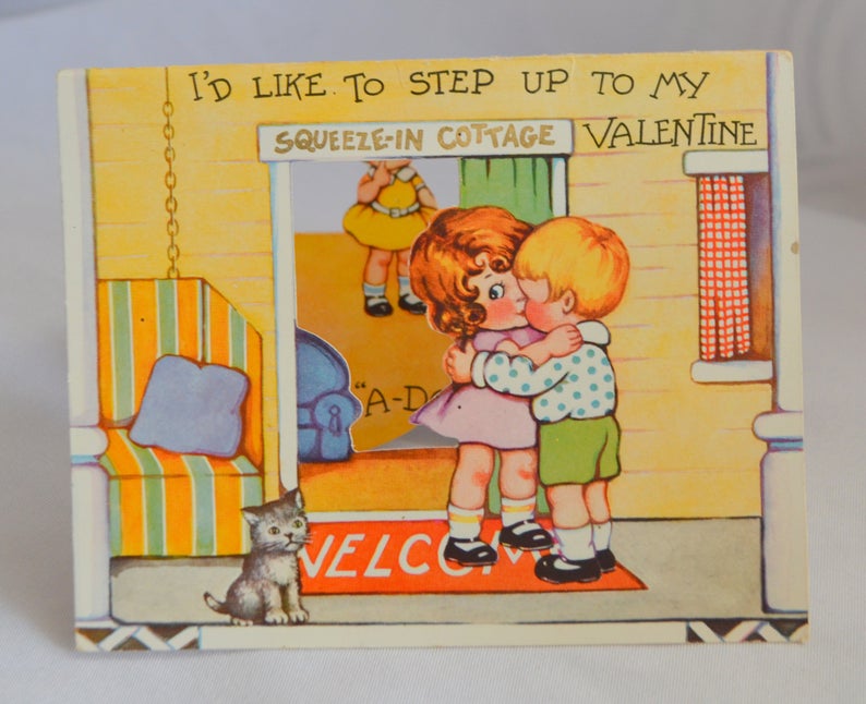 Antique Valentine's Day Card Die Cut Embossed Stand Up Two Children Kissing in Doorway Third Girl Watches with Kitty Cat